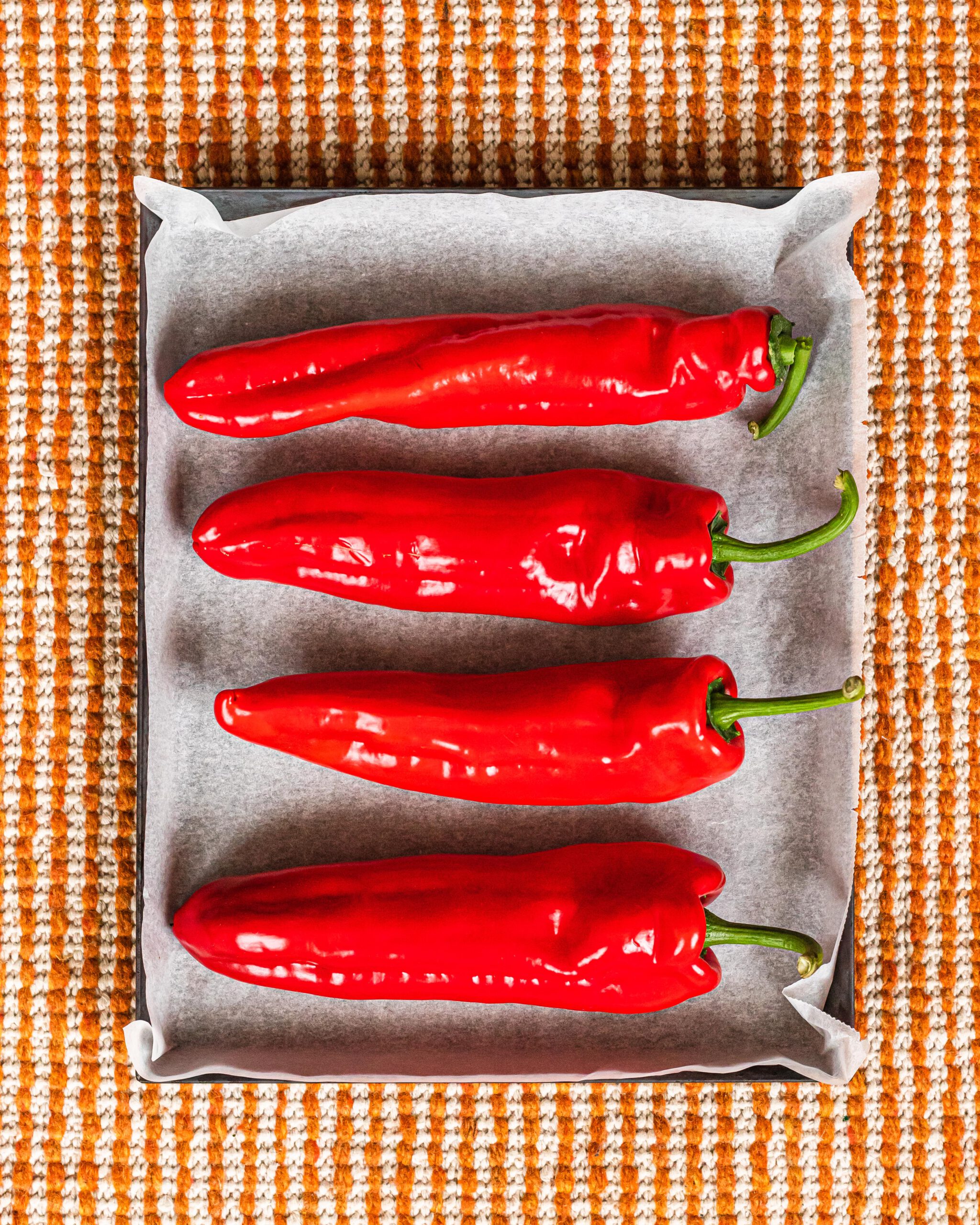 Raw bell peppers ready to be roasted