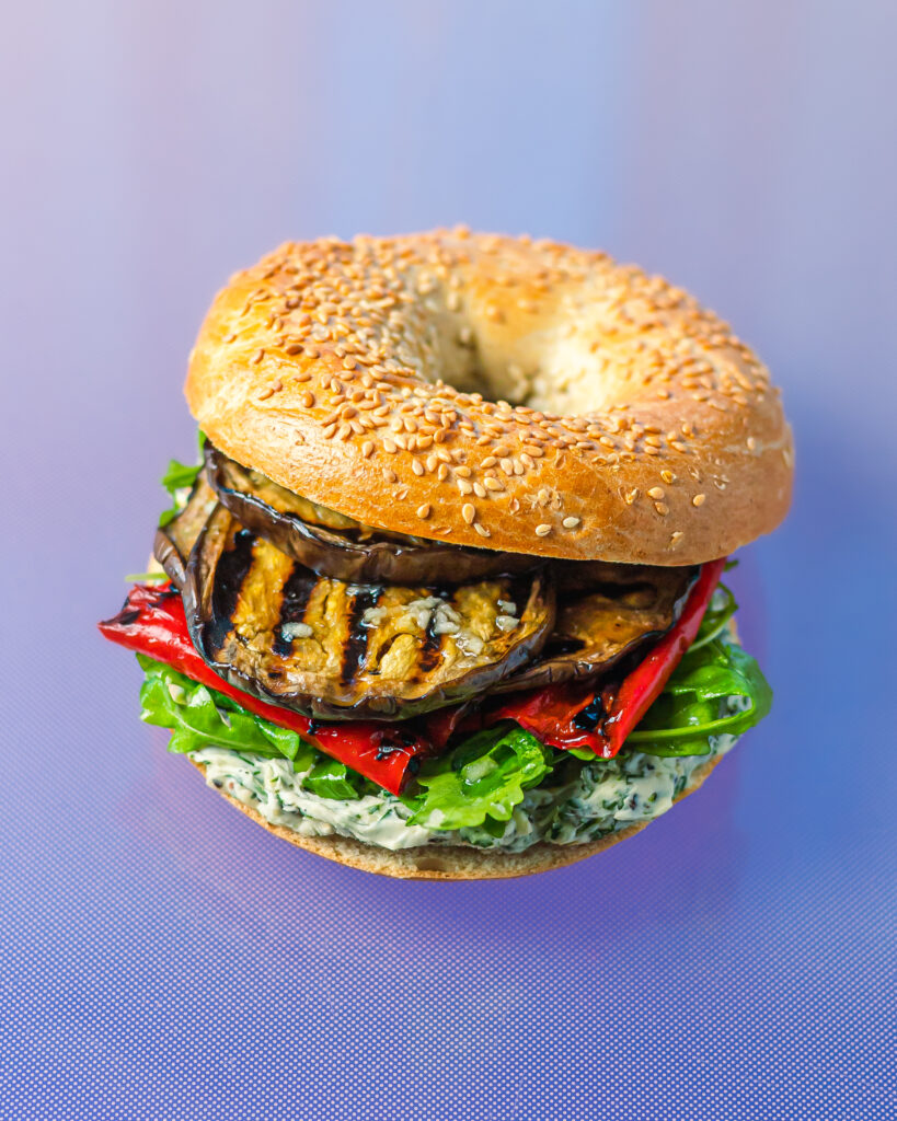 Bagel with herbed cream cheese and grilled eggplant